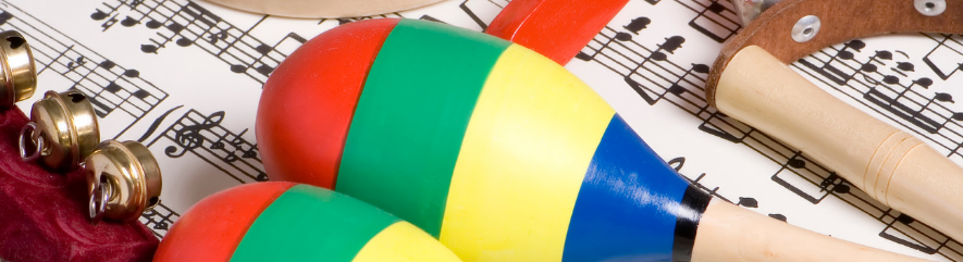 Colorful maracas and tambourines over sheet music