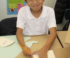 Boy drawing in class